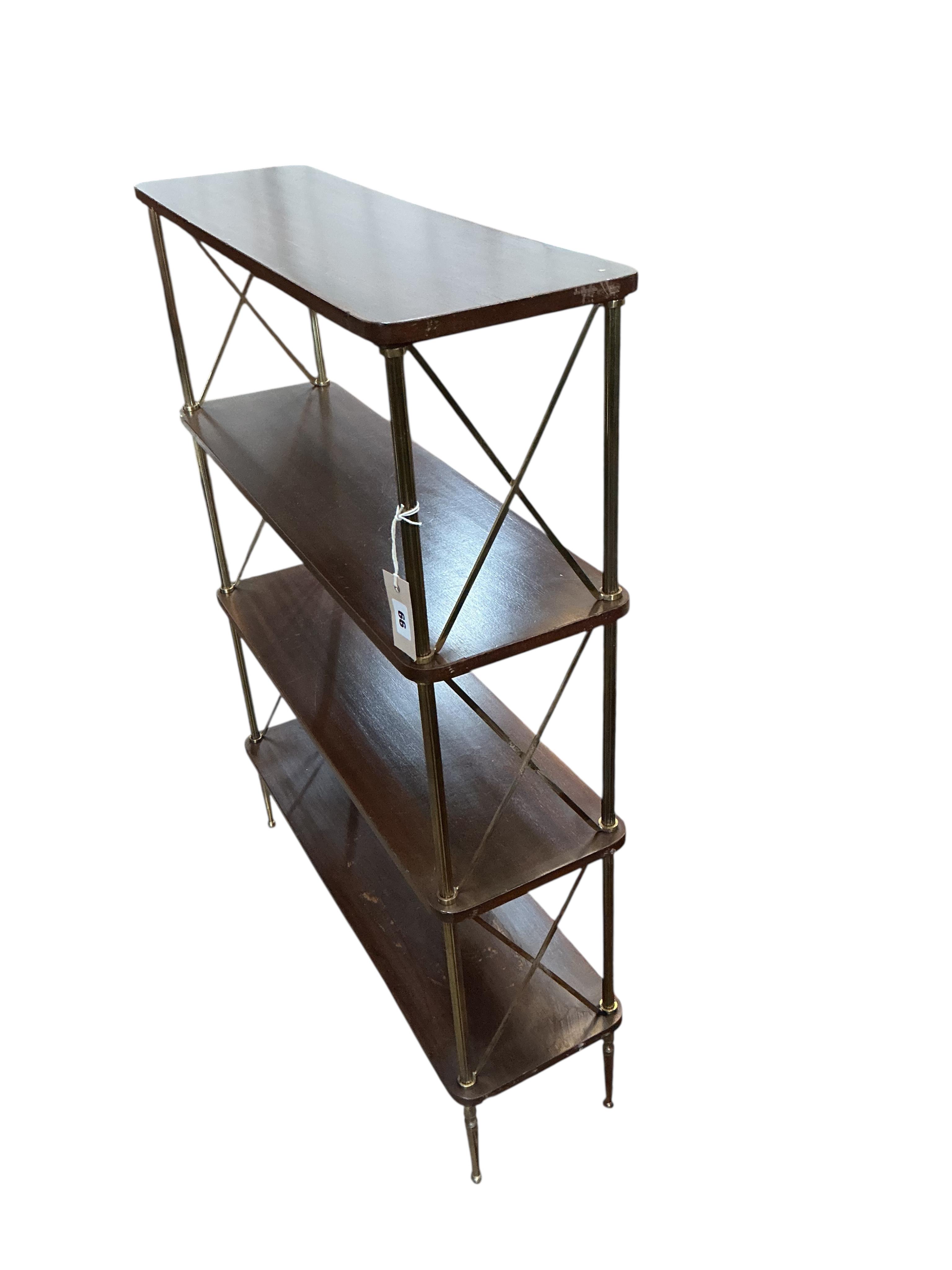 A Maison Jansen style mahogany and brass four tier open bookcase, width 75cm, depth 23cm, height 99cm
